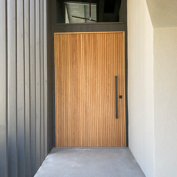 Vertical-slatted front door