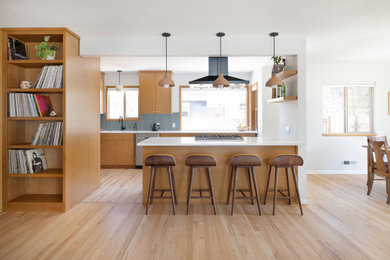 Inspiration for a large galley open concept kitchen remodel in Portland with flat-panel cabinets