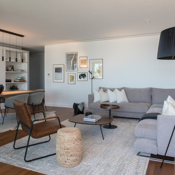 Living Room with Modular Sofa, Gallery Wall and Black Floor Lamp