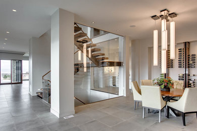 Example of a mid-sized trendy concrete floor and gray floor great room design in Denver with white walls and no fireplace