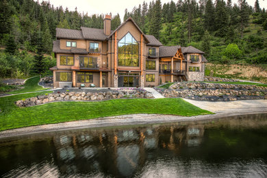 Rustic three-story wood exterior home idea in Seattle