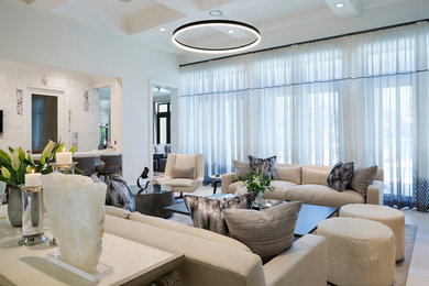 Huge minimalist enclosed limestone floor living room photo in Miami with white walls
