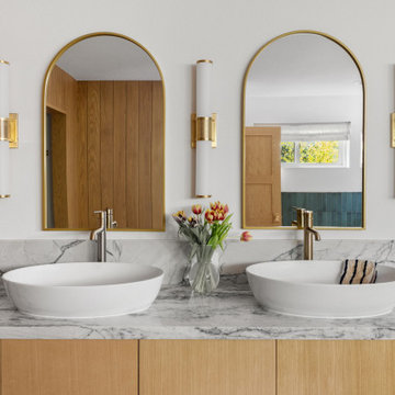 Dual vessel sinks, marble top — 90s Fixer, Reno interior design by Find Design