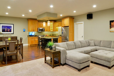 Example of a mid-sized minimalist open concept living room design in Cleveland with a wall-mounted tv