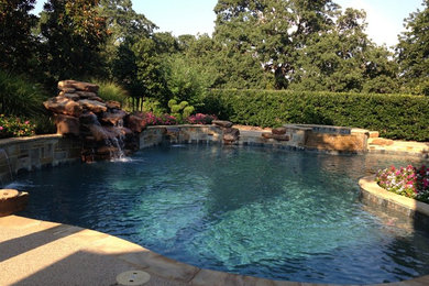 Large tuscan backyard custom-shaped natural pool fountain photo in Houston with decking