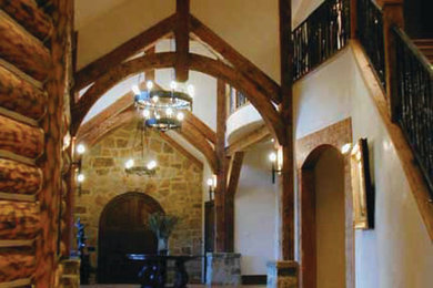 Inspiration for a large rustic double front door remodel in Denver with a dark wood front door