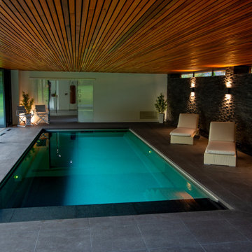 Modern sunken pool and gym complex