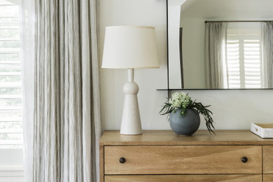 Example of a transitional master bedroom design in Boston