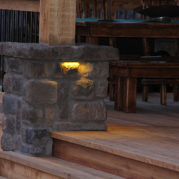 Deck lighting using low voltage under railing LED lights.
