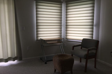 Mid-sized transitional freestanding desk carpeted and beige floor study room photo with beige walls