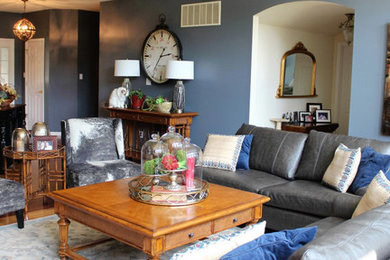 Mid-sized transitional open concept medium tone wood floor living room photo in St Louis with blue walls