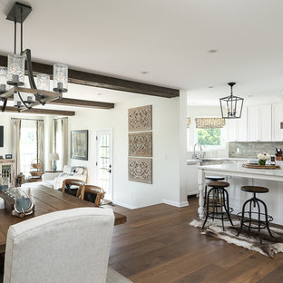 Large farmhouse open concept kitchen designs - Large cottage l-shaped medium tone wood floor and brown floor open concept kitchen photo in Other with a farmhouse sink, recessed-panel cabinets, white cabinets, marble countertops, multicolored backsplash, porcelain backsplash, stainless steel appliances, an island and white countertops