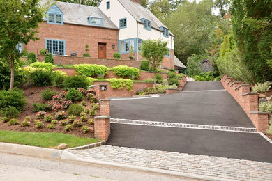 Inspiration for a large traditional full sun front yard brick landscaping in New York.