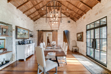 Example of a country medium tone wood floor dining room design in Austin with beige walls and no fireplace