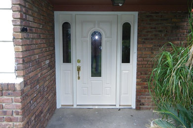 Entryway in New York with a single front door and a white front door.