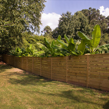 Horizontal privacy fence with rail fence