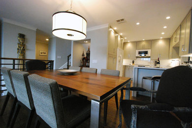 Mid-sized transitional medium tone wood floor kitchen/dining room combo photo in Los Angeles with gray walls