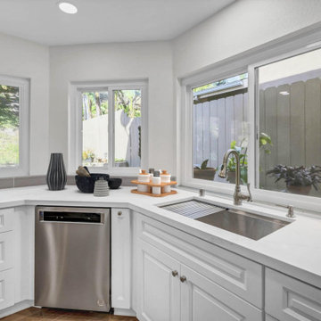 Bright Kitchen Sink Corner with Picture Windows and Sleek Finishes