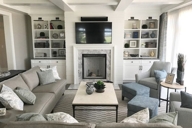 Mid-sized beach style open concept living room in Other with dark hardwood floors, a standard fireplace, a stone fireplace surround, a wall-mounted tv and brown floor.