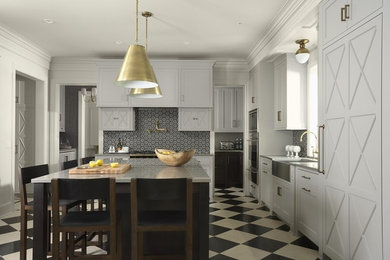 Example of a transitional kitchen design in Minneapolis with a farmhouse sink, multicolored backsplash, paneled appliances and an island
