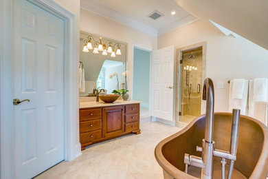 Example of a large transitional master black tile and stone tile bathroom design in Other with a vessel sink, raised-panel cabinets, medium tone wood cabinets, a hot tub and white walls