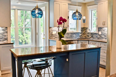 Inspiration for a mid-sized eclectic kitchen remodel in Boston with quartz countertops, blue backsplash and glass tile backsplash