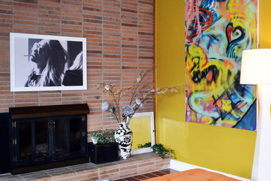 Example of a mid-sized 1960s open concept and formal brick floor and red floor living room design in Kansas City with red walls, a standard fireplace, a brick fireplace and no tv