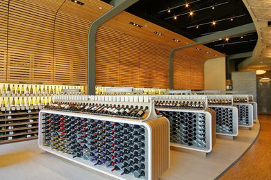 Expansive contemporary wine cellar in Dallas with storage racks.