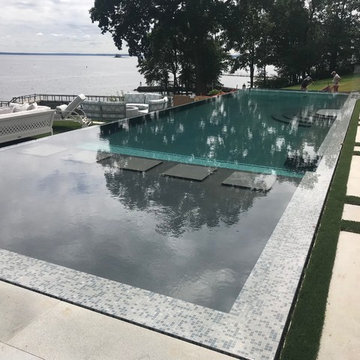 vanishing edge glass wall pool + raised perimeter overflow spa
