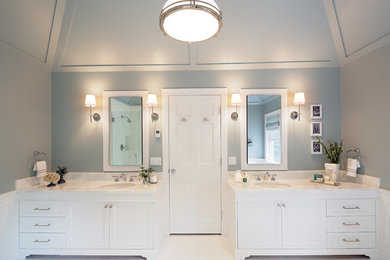 Mid-sized elegant master bathroom photo in New York with recessed-panel cabinets, white cabinets, gray walls and an undermount sink
