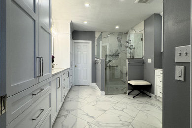 Inspiration for a mid-sized transitional master white tile and marble tile porcelain tile, white floor and double-sink bathroom remodel in Other with flat-panel cabinets, white cabinets, a two-piece toilet, gray walls, an undermount sink, quartz countertops, a hinged shower door, white countertops and a built-in vanity