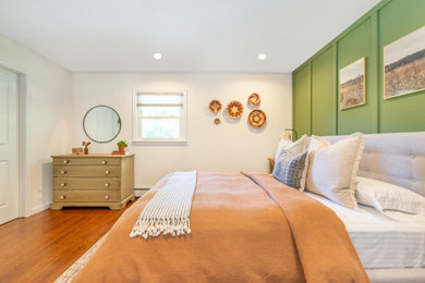 Bedroom - eclectic guest dark wood floor bedroom idea in New York with multicolored walls