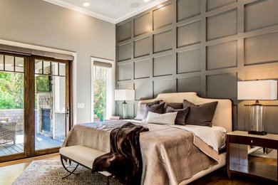 Bedroom - large modern master light wood floor and brown floor bedroom idea in New York with gray walls, a standard fireplace and a stone fireplace