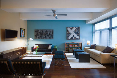 Inspiration for a contemporary living room remodel in New York with blue walls, no fireplace and a wall-mounted tv