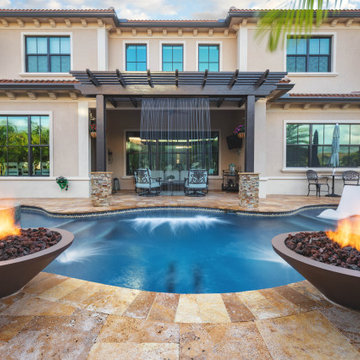 Custom Pool with Spa, Sun Shelf, and Pebble Tec Finish in Parkland Fla.