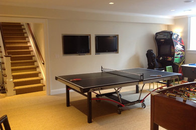 Example of a mid-sized classic underground carpeted basement design in Boston with beige walls