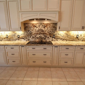 Full height back splash ivory kitchen.