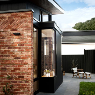 Inspiration for a contemporary backyard patio in Adelaide with no cover.