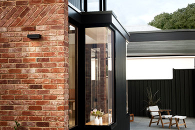 Inspiration for a contemporary backyard patio in Adelaide with no cover.