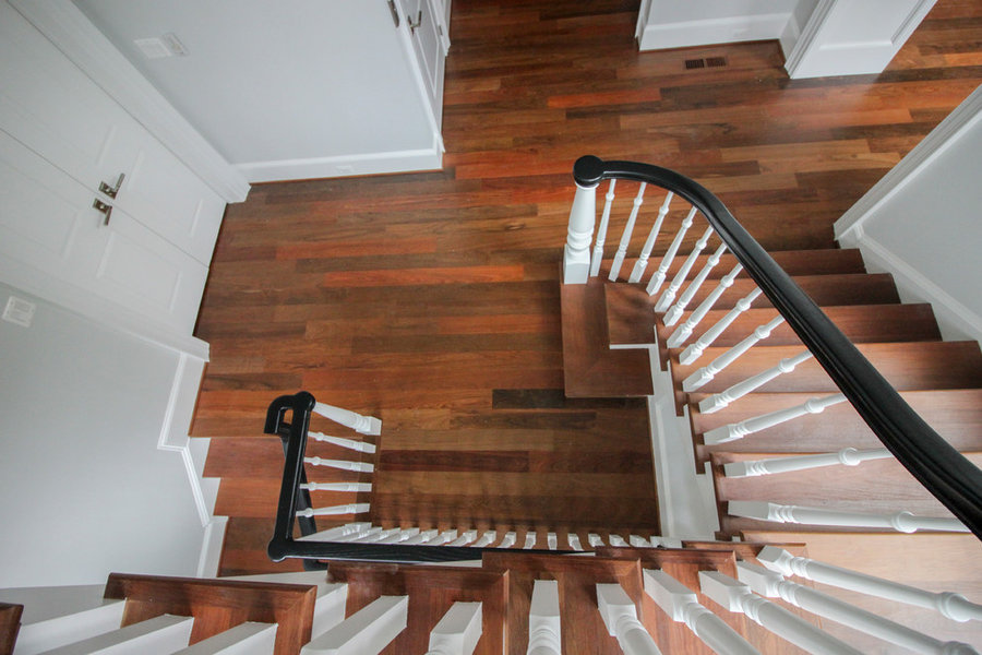 Powerful Impression by Floating Staircase in Suburban Foyer