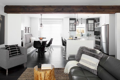 Example of a transitional dark wood floor kitchen design in Montreal with an undermount sink, shaker cabinets, black cabinets, quartz countertops, gray backsplash, ceramic backsplash, stainless steel appliances and an island