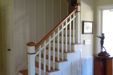 Arts and crafts wooden staircase photo with painted risers