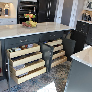 Quad Cities Kitchen With Gray Base Cabinets and Waterfall Counters
