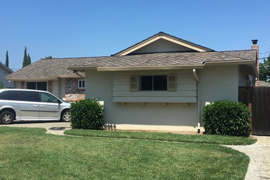 Mid-sized elegant beige one-story stucco gable roof photo in San Francisco