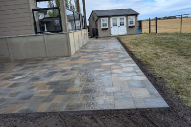 Example of a transitional home design design in Calgary