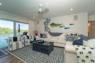 Design ideas for a beach style family room in Miami.