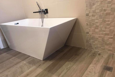 Mid-sized mountain style 3/4 bathroom photo in New York with raised-panel cabinets