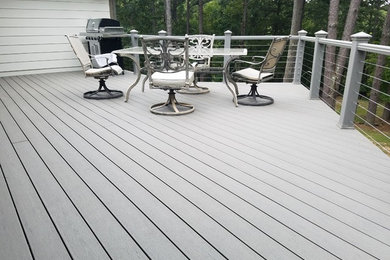Example of a large backyard deck design in Other with no cover