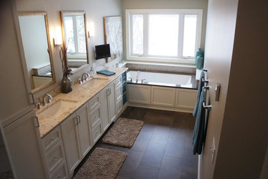Bathroom - mid-sized traditional master porcelain tile and brown floor bathroom idea in Minneapolis with shaker cabinets, white cabinets, an undermount tub, beige walls, an undermount sink and quartzite countertops