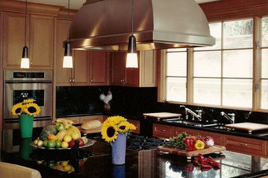 Inspiration for a large contemporary u-shaped medium tone wood floor kitchen pantry remodel in San Francisco with green backsplash, an undermount sink, recessed-panel cabinets, light wood cabinets, marble countertops, stone slab backsplash, stainless steel appliances and an island